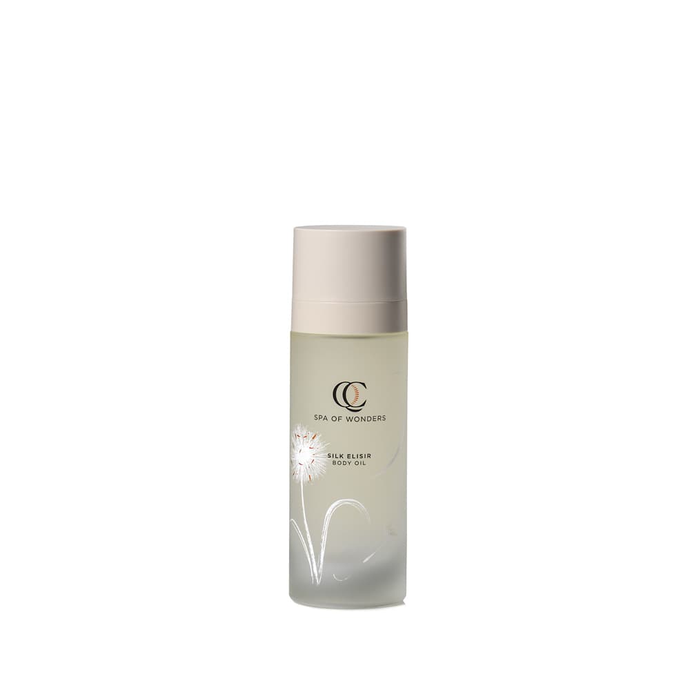 Flacone in vetro trasparente con olio corpo Silk Elixir, liquido giallo chiaro, tappo beige, formato 100 ml, etichetta frontale.